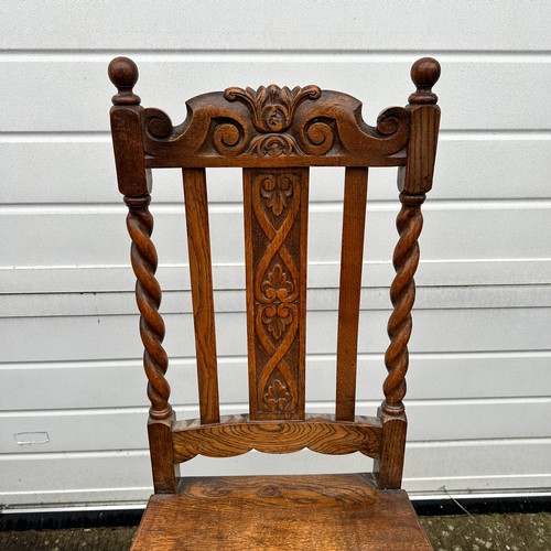 442 - Pair of carved oak hall chairs with barley twist supports and front legs. Height 107cm, width 48cm, ... 