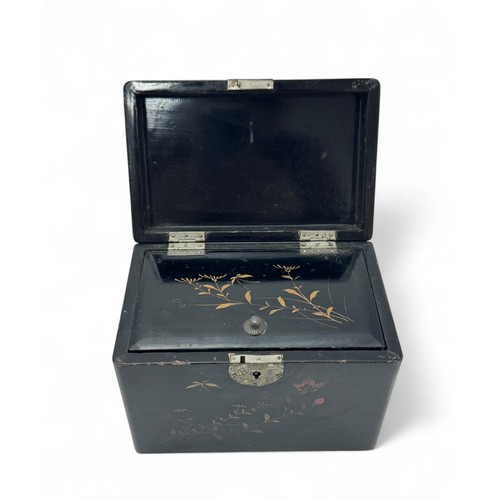 299 - A Japanese black lacquer tea caddy with hand painted bird and flower decoration.