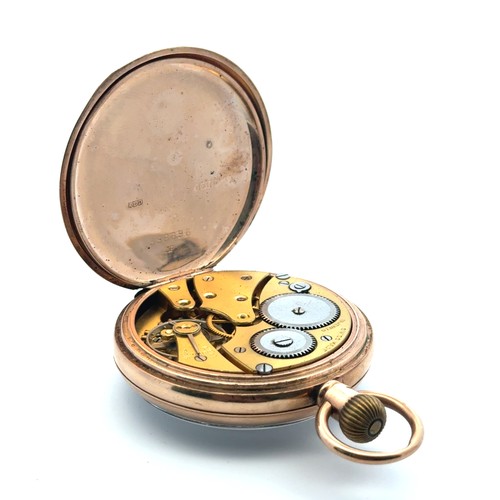 87 - A 9ct gold 15 jewel open face pocket watch with white enamel dial and Roman numeral hour markers. Sw... 