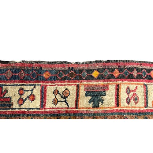 276 - Large Eastern, possibly Turkish, woven ground rug, stylised floral and geometric pattern with red ba... 