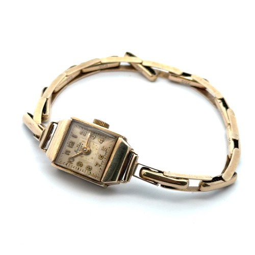 96 - A 9ct gold Bentima ladies cocktail watch on a gold expanding spring link bracelet. 12.73g