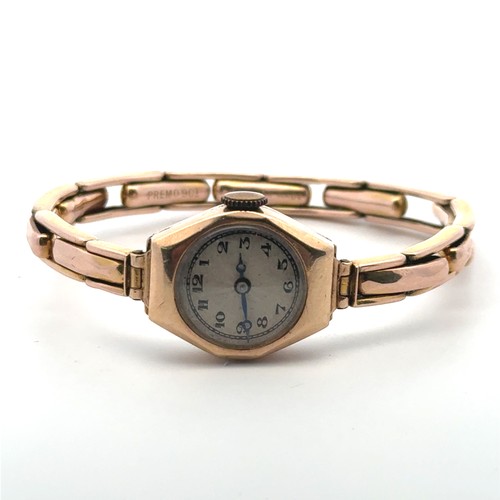 98 - A 9ct gold watch hallmarked to inner case,  on an expandable bracelet stamped 9ct. 12.14g.