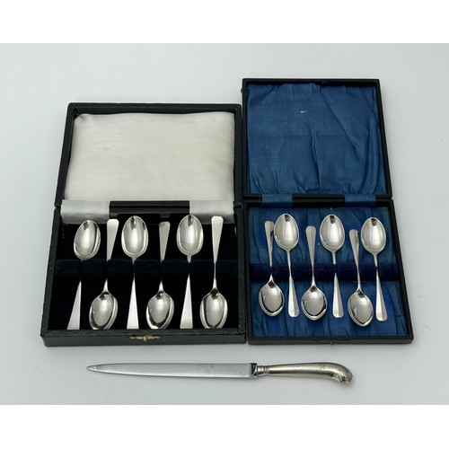 128 - Two sets of silver teaspoons and a silver handled knife.