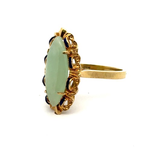 3 - A marquise jade set in a ring stamped 750 with blue enamel decoration. Size L. 4.75g