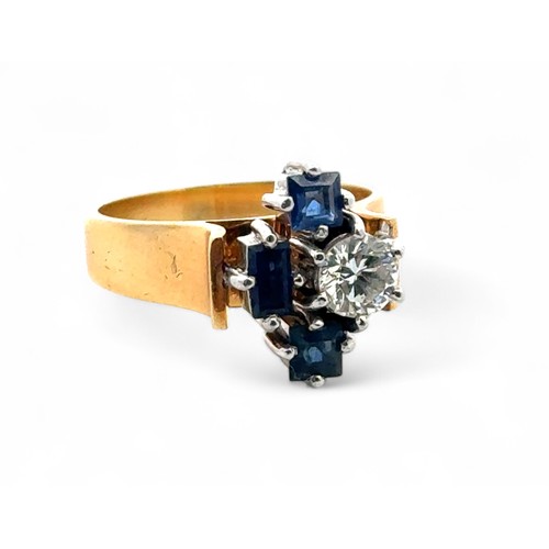 44 - An unusual sapphire and diamond ring, size L. Stamped 18ct. Diamond approx 0.5ct. Weight 6.0g.