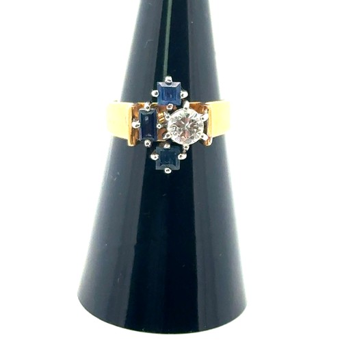 44 - An unusual sapphire and diamond ring, size L. Stamped 18ct. Diamond approx 0.5ct. Weight 6.0g.