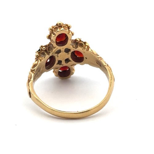 57 - A 18ct gold, garnet and diamond ring, size O/P. Weight 5.68g