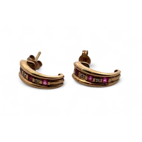 61 - A pair of ruby and diamond C hoop earrings in unmarked gold (tests as 9ct using XRF).