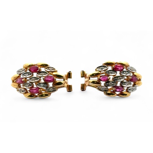 8 - A pair of ruby and diamond earrings in 18ct yellow gold.