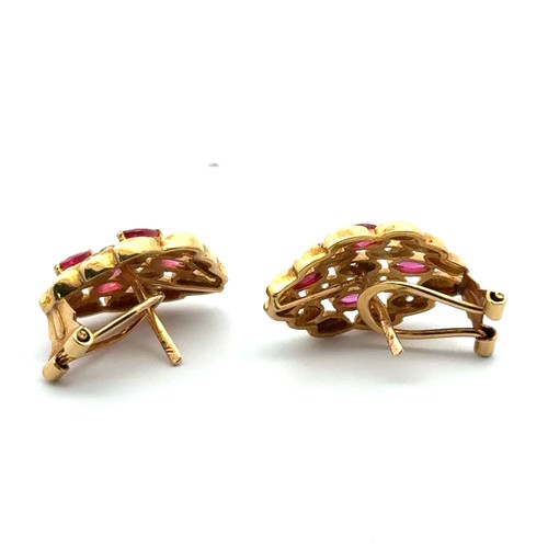 8 - A pair of ruby and diamond earrings in 18ct yellow gold.