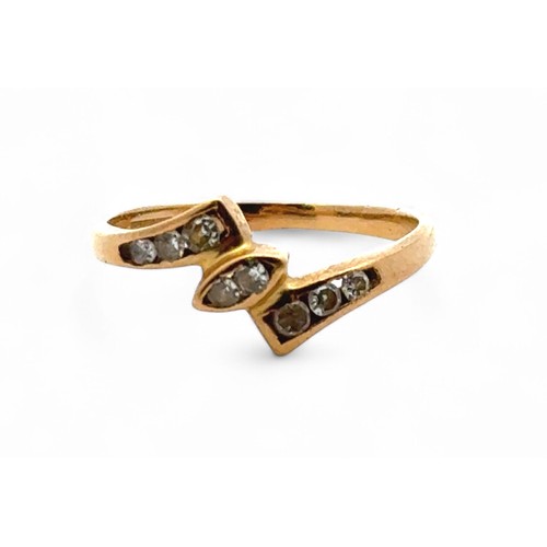 29 - A yellow gold ring set with several small diamonds, tests as 18ct using XRF. Size L/M.