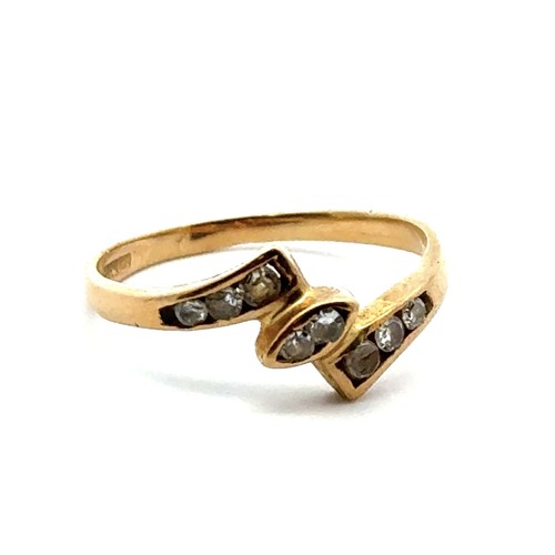 29 - A yellow gold ring set with several small diamonds, tests as 18ct using XRF. Size L/M.