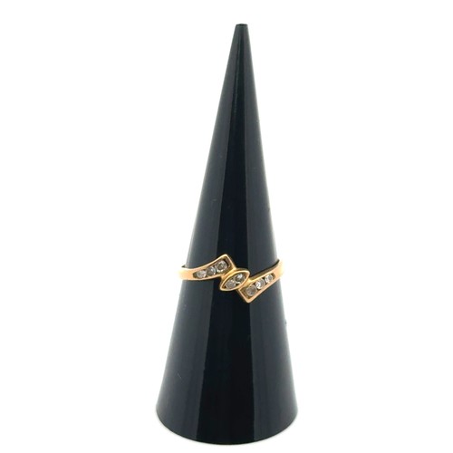 29 - A yellow gold ring set with several small diamonds, tests as 18ct using XRF. Size L/M.