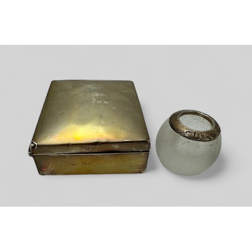 138 - A silver-gilt box with wooden lining 9 x 7.5cm, and a small silver mounted match striker.