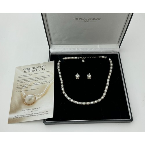 65 - A Pearl Company freshwater pearl and white stone necklace and earring set with silver clasp in origi... 