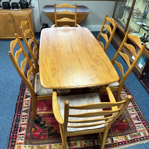 427 - Ercol – Southwold – an Ercol Southwold Dining Set including table, four dining chairs and two carver... 