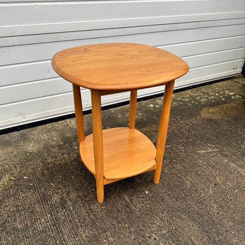 433 - Ercol – an Ercol blonde elm side table, with circular top. Height 65cm, diameter 54cm.