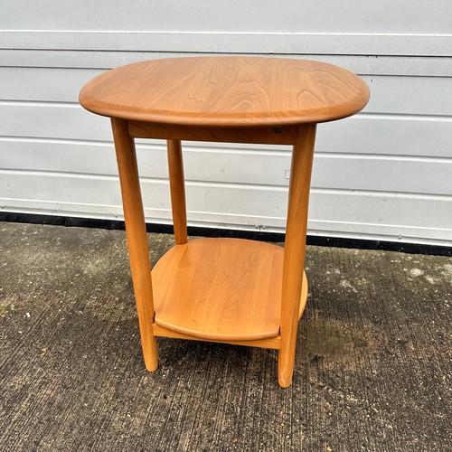 433 - Ercol – an Ercol blonde elm side table, with circular top. Height 65cm, diameter 54cm.