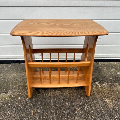 434 - Ercol – an Ercol blonde elm “Evergreen” magazine rack. Height 49cm, width 55cm, depth 36cm.