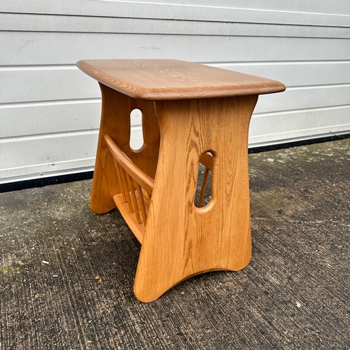 434 - Ercol – an Ercol blonde elm “Evergreen” magazine rack. Height 49cm, width 55cm, depth 36cm.