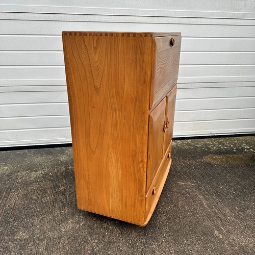 435 - Ercol – an Ercol Windsor model 430 elm serving cabinet or drinks cabinet, with fall-front above doub... 