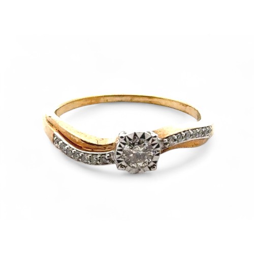 59 - 9ct yellow gold solitaire-style ring set with round brilliant cut diamond set shoulders in a twist-s... 