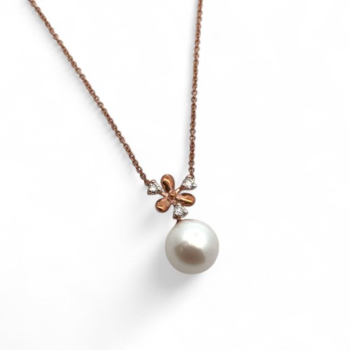 15 - A snowflake design 9ct rose gold cultured pearl and diamond necklace. Chain 18