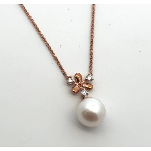 15 - A snowflake design 9ct rose gold cultured pearl and diamond necklace. Chain 18