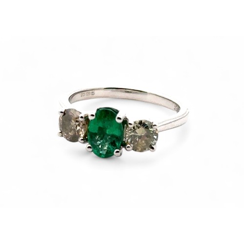 33 - Certificated 18ct white gold emerald and diamond trilogy ring. Emerald 0.66ct. Diamonds 0.37ct. Cert... 