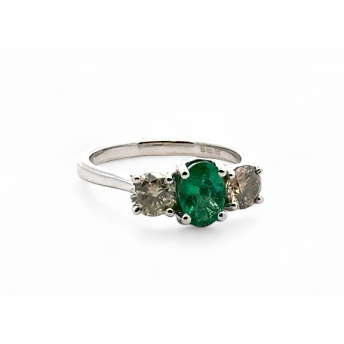 33 - Certificated 18ct white gold emerald and diamond trilogy ring. Emerald 0.66ct. Diamonds 0.37ct. Cert... 