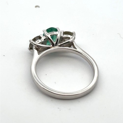 33 - Certificated 18ct white gold emerald and diamond trilogy ring. Emerald 0.66ct. Diamonds 0.37ct. Cert... 