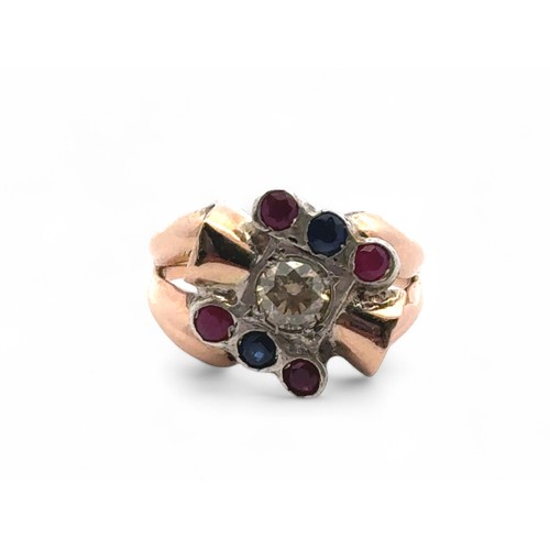 50 - A 9ct yellow and white gold ring set with 0.50ct of diamonds, as well as rubies and sapphires. With ... 