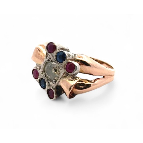 50 - A 9ct yellow and white gold ring set with 0.50ct of diamonds, as well as rubies and sapphires. With ... 