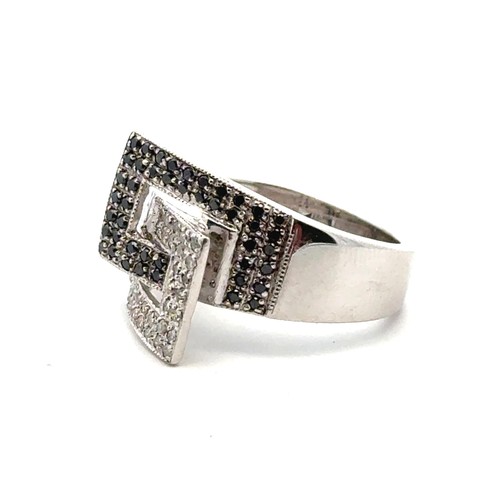 17 - A 9ct white gold ring set with black and white diamonds, size K. Diamonds 0.45ct approx. Weight 5.41... 