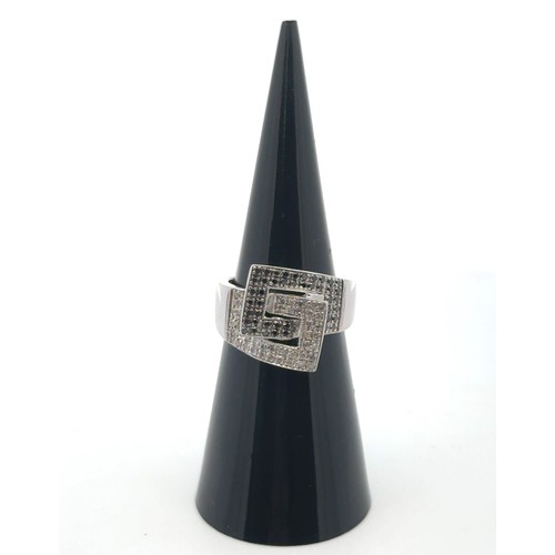 17 - A 9ct white gold ring set with black and white diamonds, size K. Diamonds 0.45ct approx. Weight 5.41... 