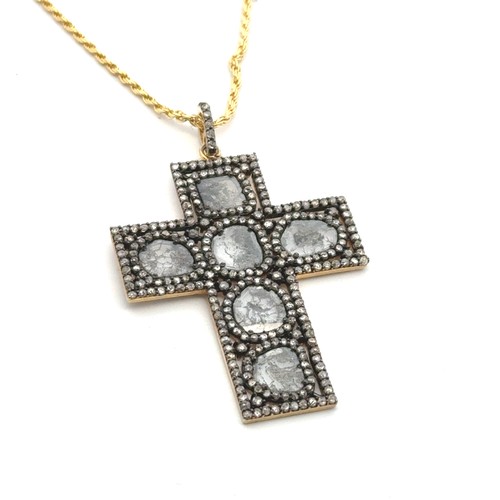 55 - An unusual silver-gilt cross set with slice-cut and rose-cut diamonds on a silver rope link chain. D... 