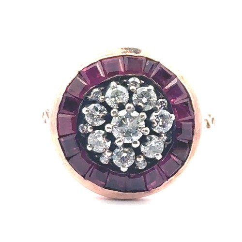 52 - A rose gold target style ring set with diamonds and rubies with patterned shoulders. Rubies 0.85ct a... 