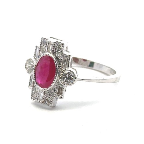 5 - An 18ct white gold Art Deco style ring set, size O/P.  Set with an oval ruby and with baguette and r... 