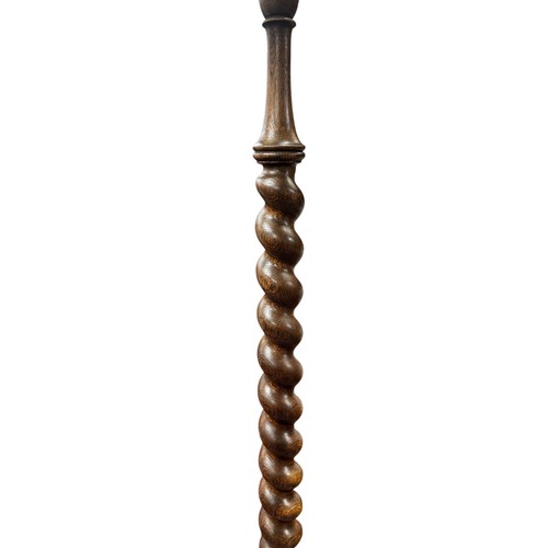 444 - Early 20th Century oak barley twist standing floor lamp on three feet. Height 145cm.