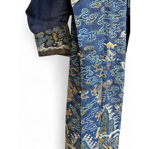 296 - Chinese Late 19th / Early 20th Century silk blue ground Dragon robe with gold thread. Finely embroid... 