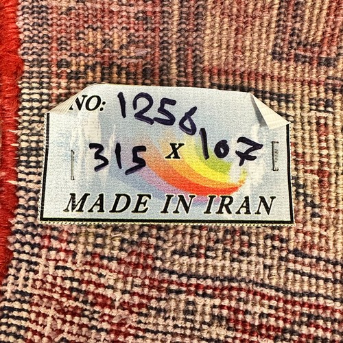 275 - High Quality Persian 'Runner' Rug. With label 'Made in Iran'. Length 312cm x 109cm Width. BUYER TO C... 