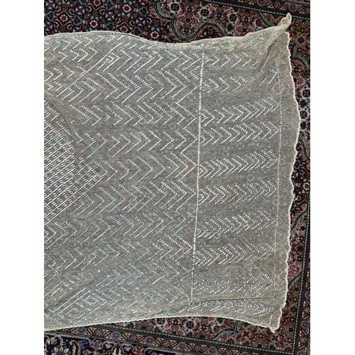 288 - Early 20th Century Egyptian Assuit shawl cream lace with white metal geometric patten. 235cm x 67cm.