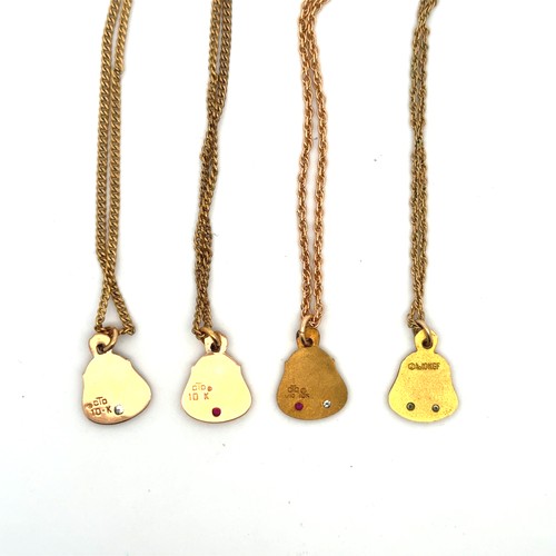 71 - A range of four yellow metal Hoover pattern pendants, each set two gemstones and stamped 'CTO 10K'.