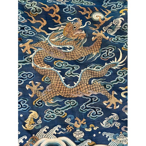 296 - Chinese Late 19th / Early 20th Century silk blue ground Dragon robe with gold thread. Finely embroid... 