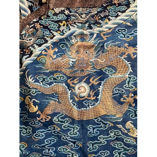 296 - Chinese Late 19th / Early 20th Century silk blue ground Dragon robe with gold thread. Finely embroid... 