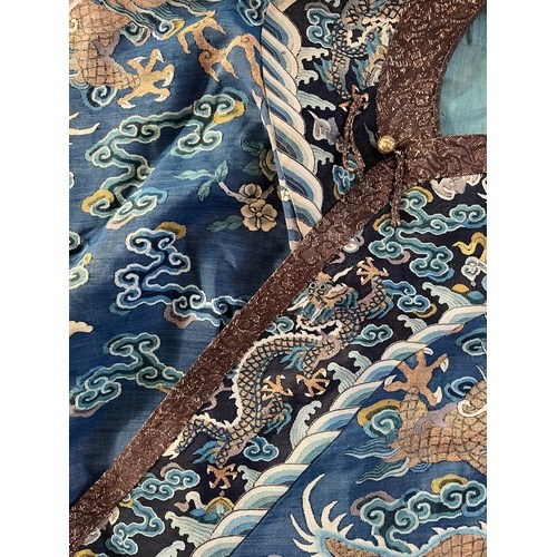 296 - Chinese Late 19th / Early 20th Century silk blue ground Dragon robe with gold thread. Finely embroid... 