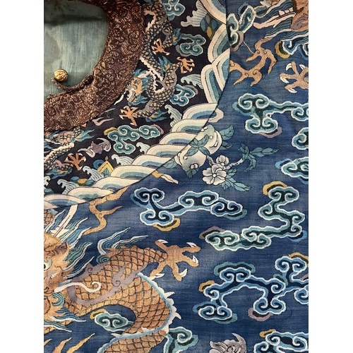 296 - Chinese Late 19th / Early 20th Century silk blue ground Dragon robe with gold thread. Finely embroid... 