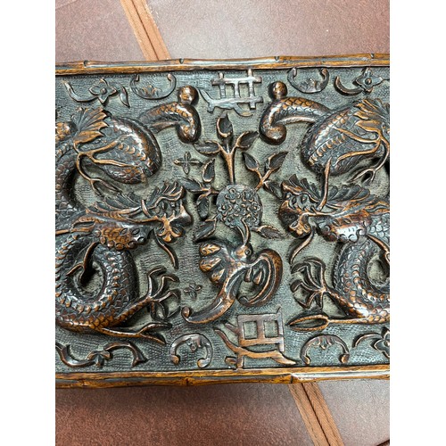 293 - Chinese carved wooden box with dragon design to lid, lid on hinges. Height 5cm, length 31cm, depth 2... 