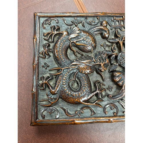 293 - Chinese carved wooden box with dragon design to lid, lid on hinges. Height 5cm, length 31cm, depth 2... 