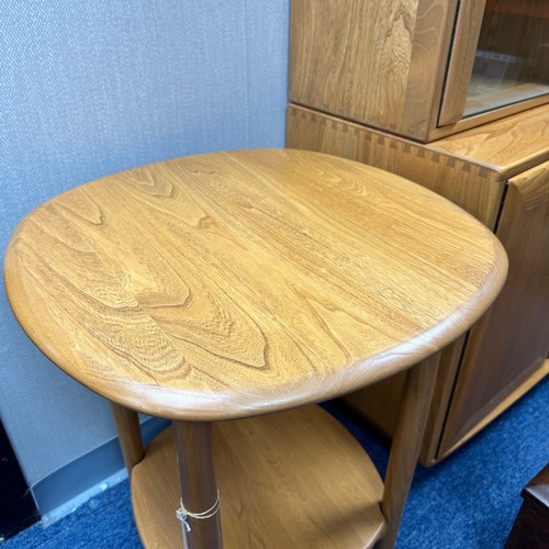 433 - Ercol – an Ercol blonde elm side table, with circular top. Height 65cm, diameter 54cm.